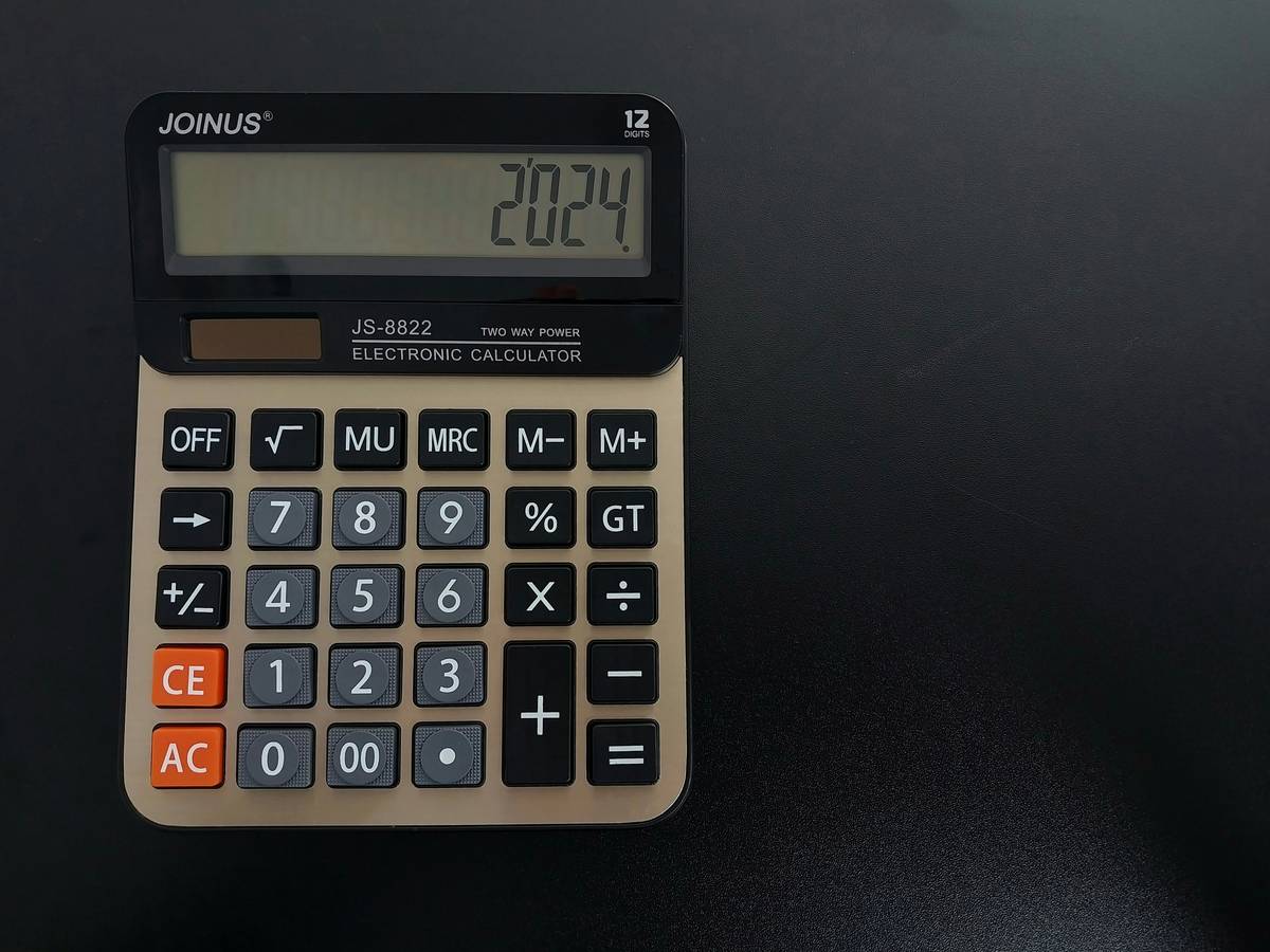 Close-up of mixed scrap gold items on a digital scale showing pricing value scrap gold how to
