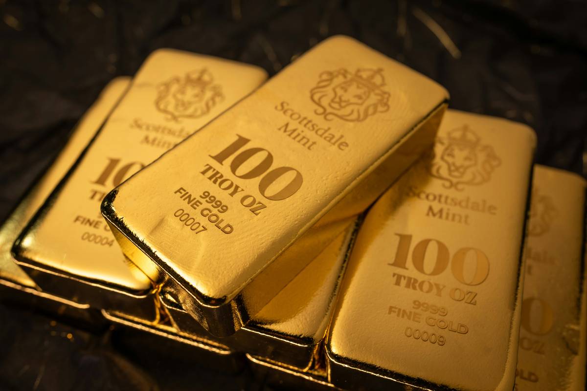 Pile of broken gold chains and rings with a digital scale – is scrap gold worth anything