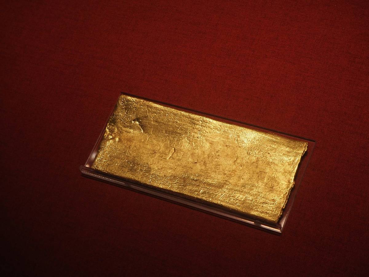 Close-up of mixed scrap gold items with price tags showing pricing value scrap gold what has